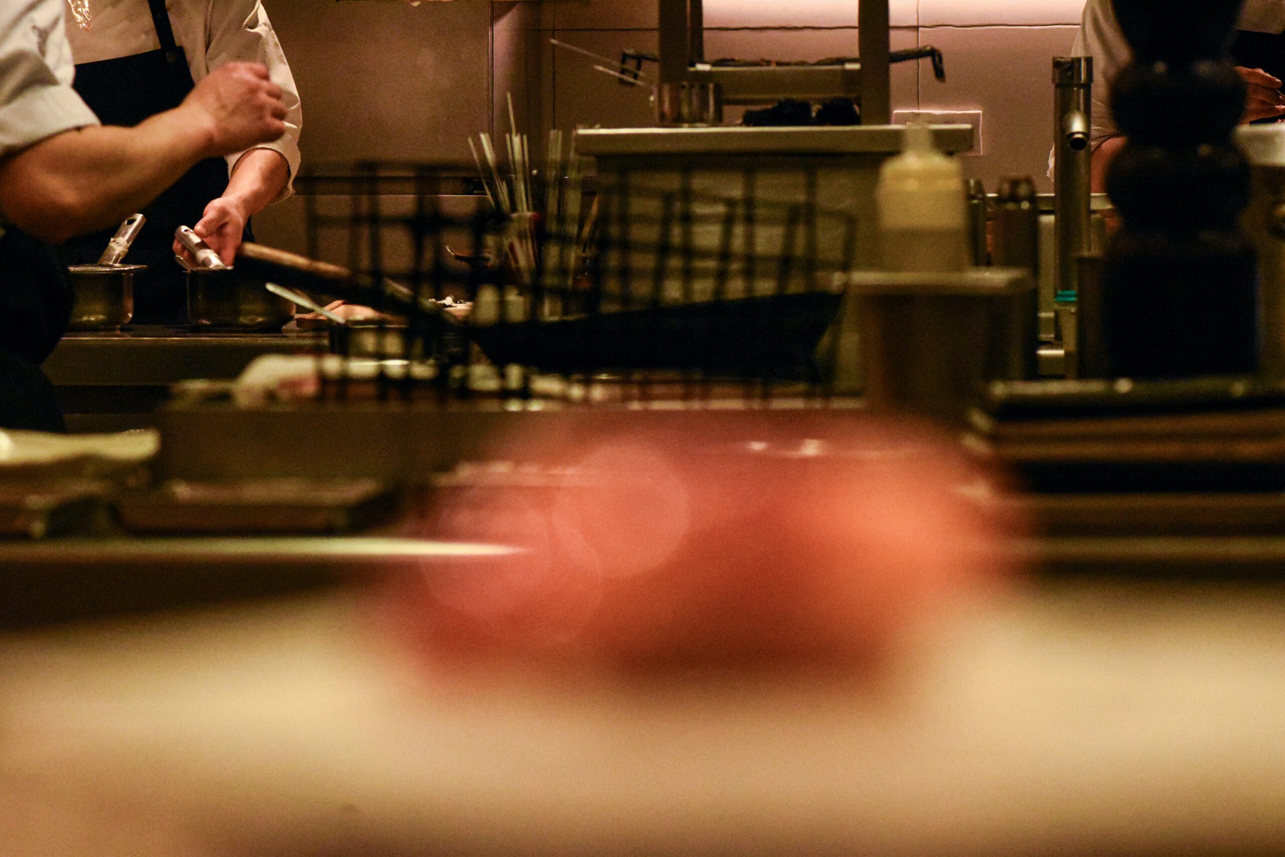 catering chef with appetizer in foreground